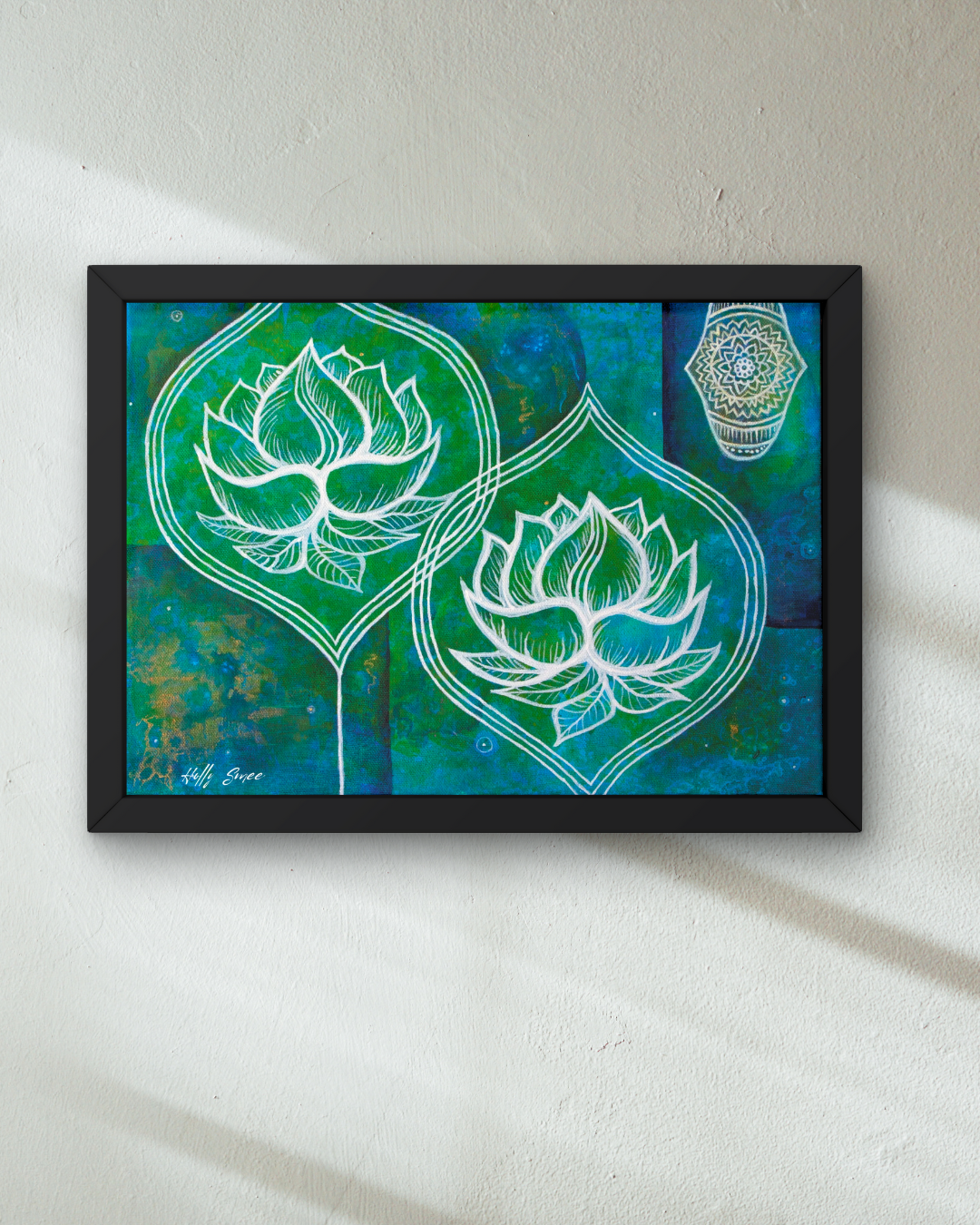 Framed artwork with lotus flowers on a teal background