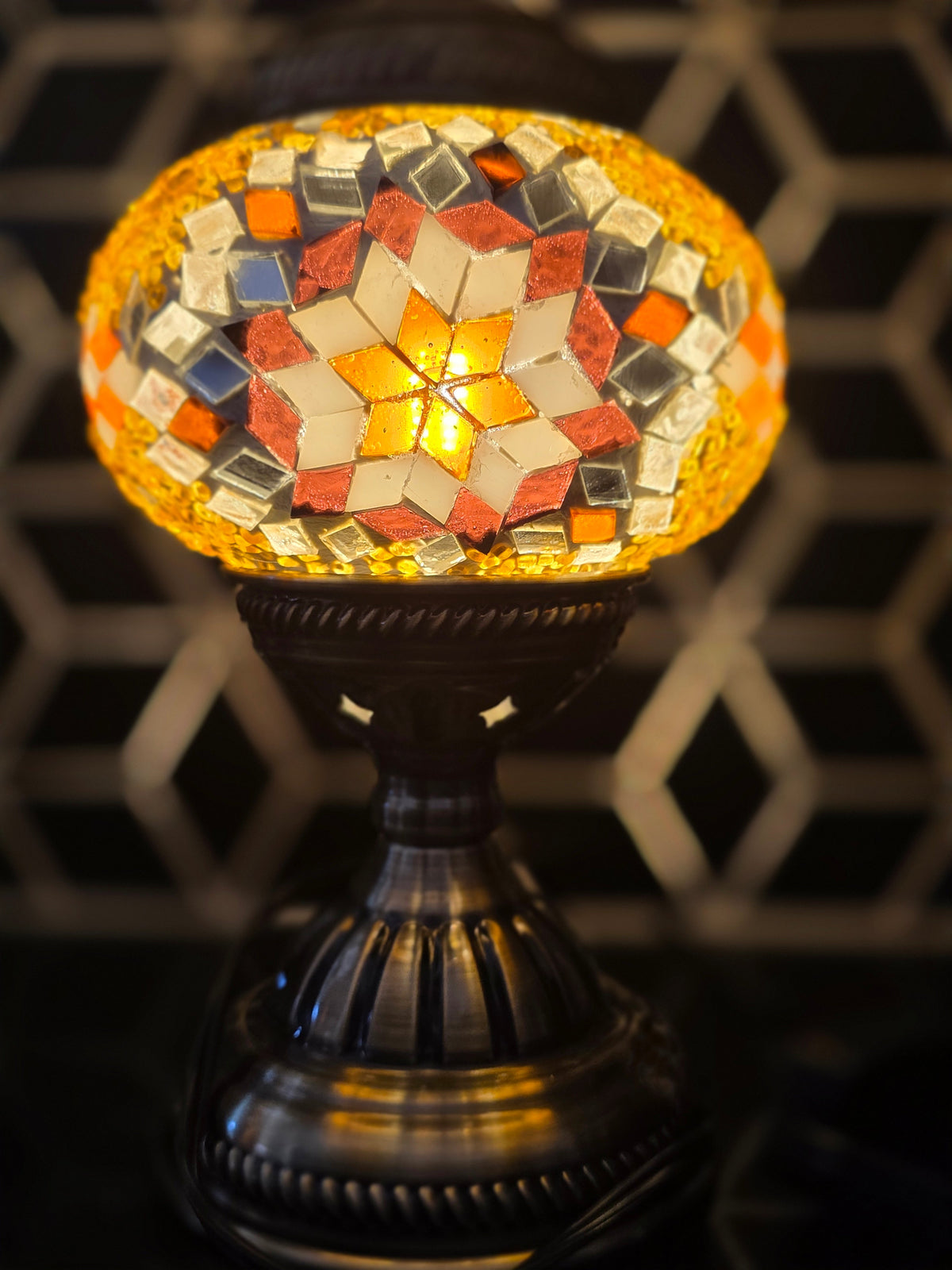 Golden Star Turkish Mosaic Lamp in a serene setting, embodying beauty and tranquility with its exquisite glass design.