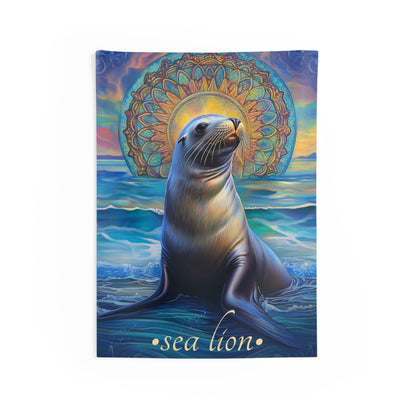 A wall tapestry featuring a sea lion with a glowing ocean mandala and sunset in the background, representing coastal and boho-inspired decor.