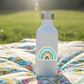 Happy Rainbow sticker on water bottle