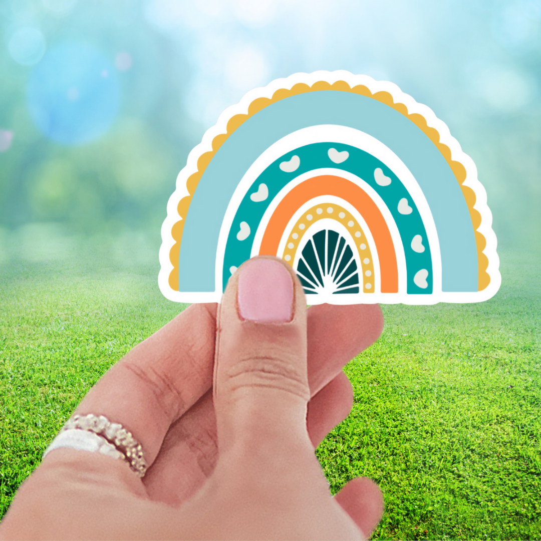 Happy Blue Rainbow Sticker featuring a colorful heart design, perfect for personalizing your belongings.