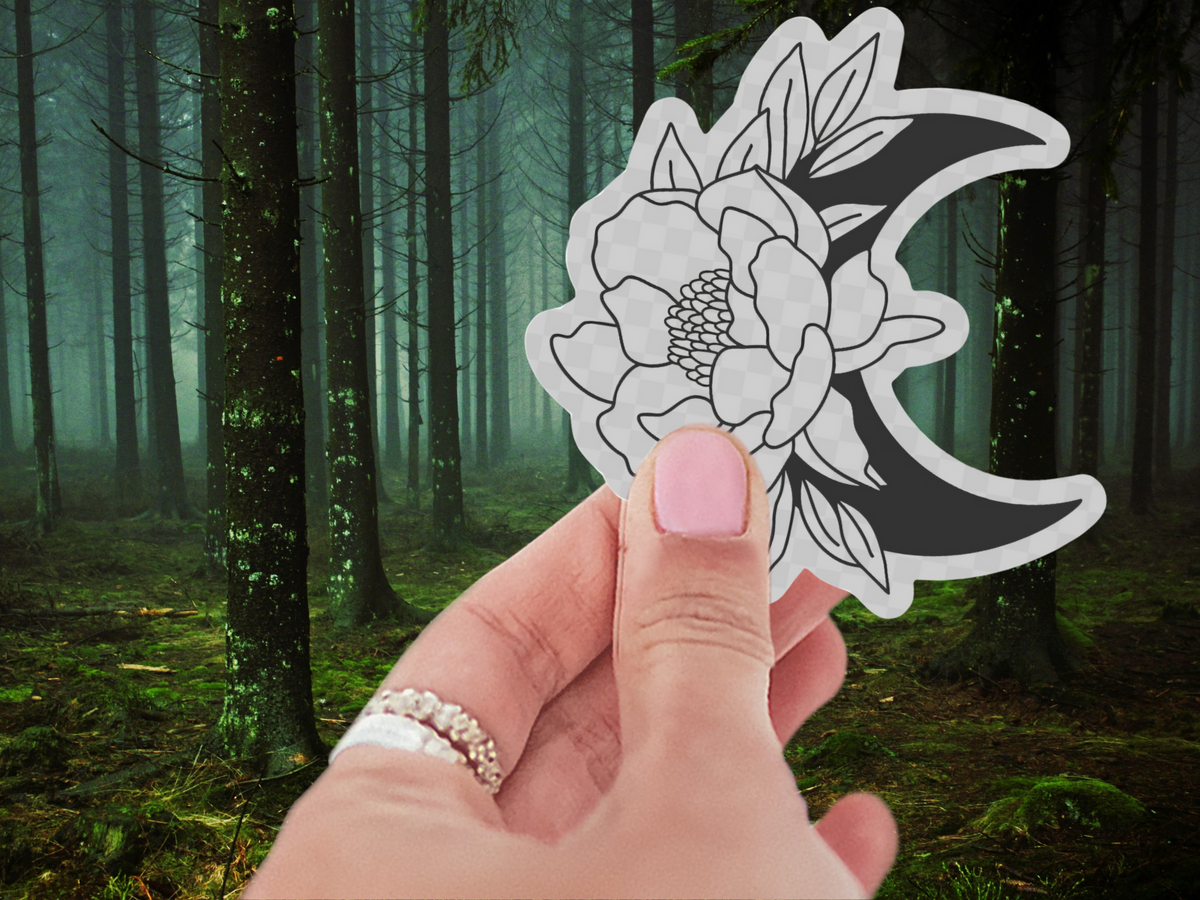 Flat lay of the Lunar Garden Waterproof Vinyl Sticker, displaying a sophisticated crescent moon and floral theme, perfect as a stylish crescent moon sticker for decorating.