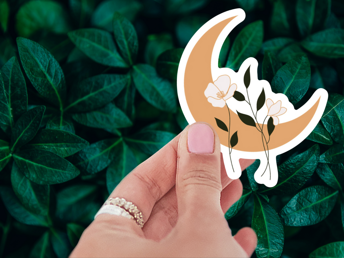 Enchanting Floral Moon Sticker applied on a laptop, demonstrating its durability as a waterproof vinyl decoration.
