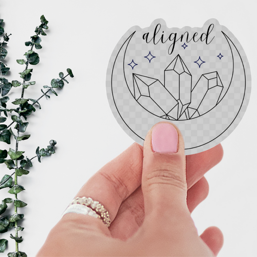 I Am Aligned Waterproof Vinyl Sticker featuring a stunning crescent moon design and vibrant crystals, perfect as a crystal sticker for indoor and outdoor use.