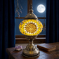 Sunflower lamp beside a moonlit window