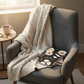 Vintage Black Floral Notebook on Cozy Chair with Natural Light